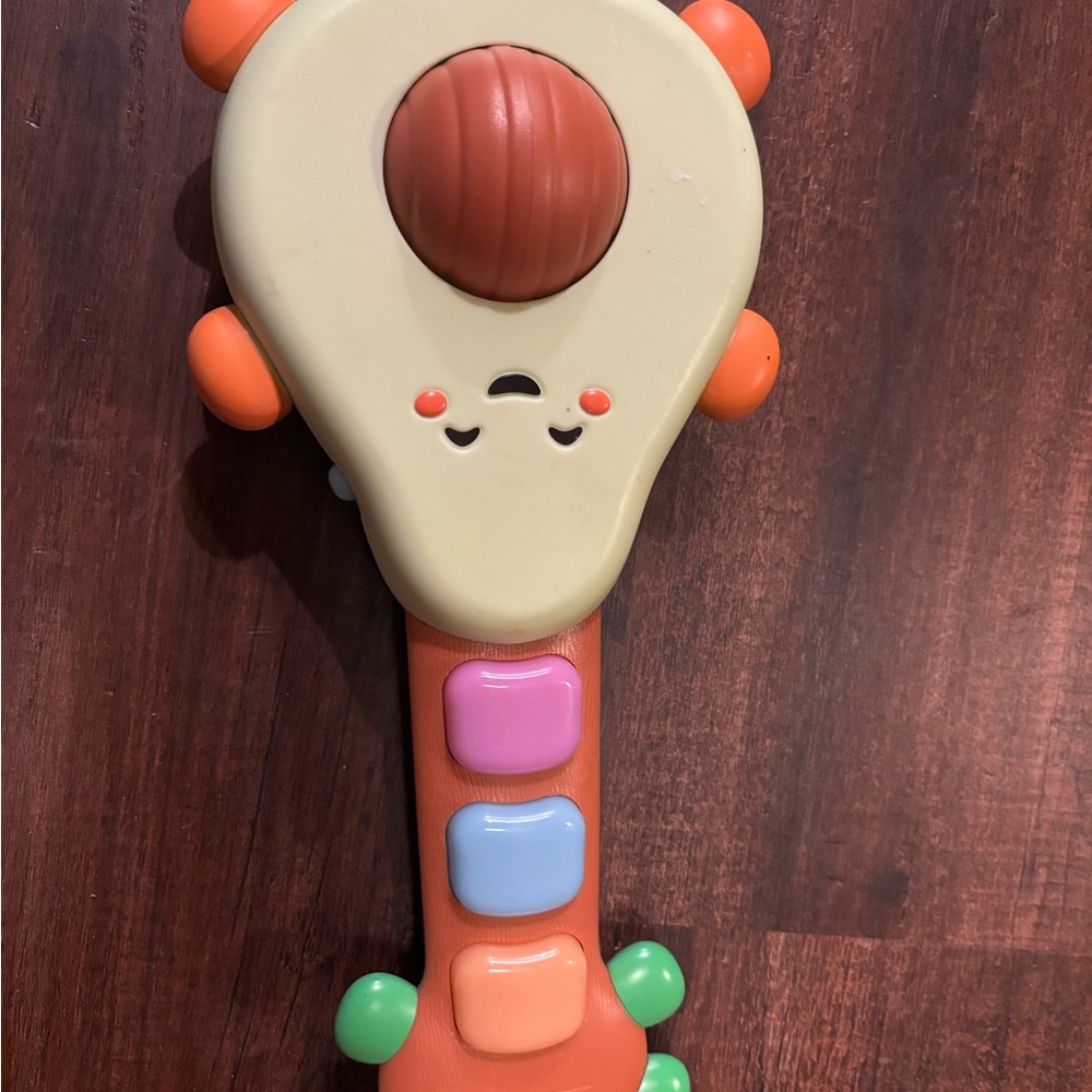Cream and Orange Learning Toy Rattle